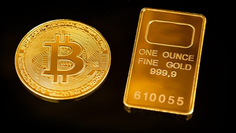 Gold Hits Nine-Month Low as Bitcoin Climbs Amid Hawkish Fed Stance